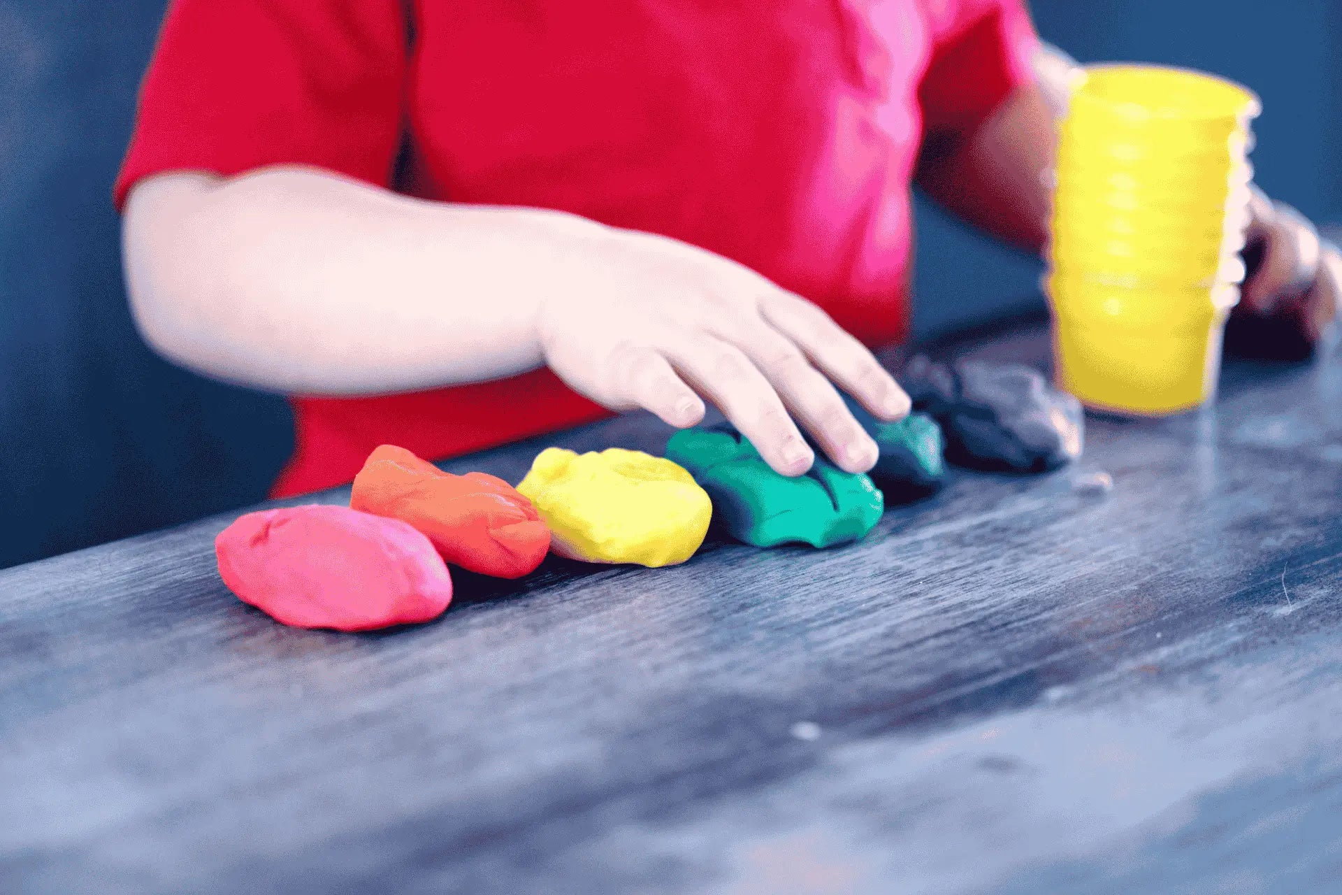 Neurodivergent Child playing with some play doh getting some sensory input
