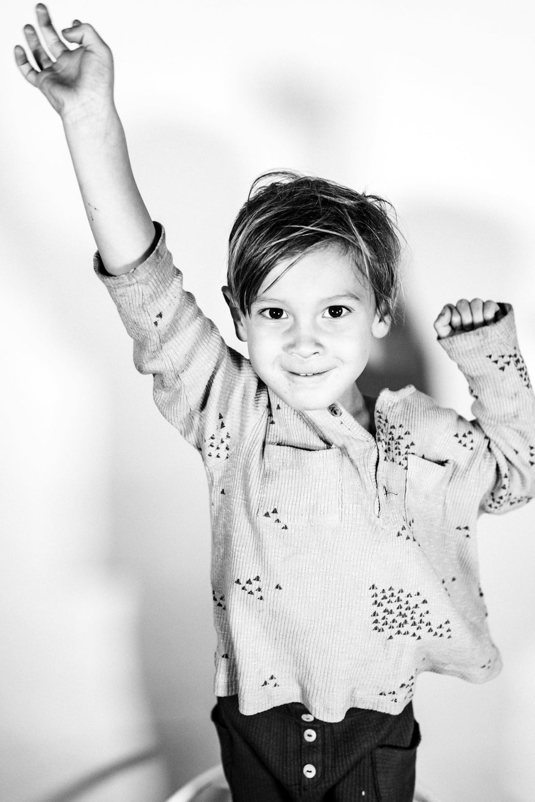 grayscale photo of girl in polka dot long sleeve shirt