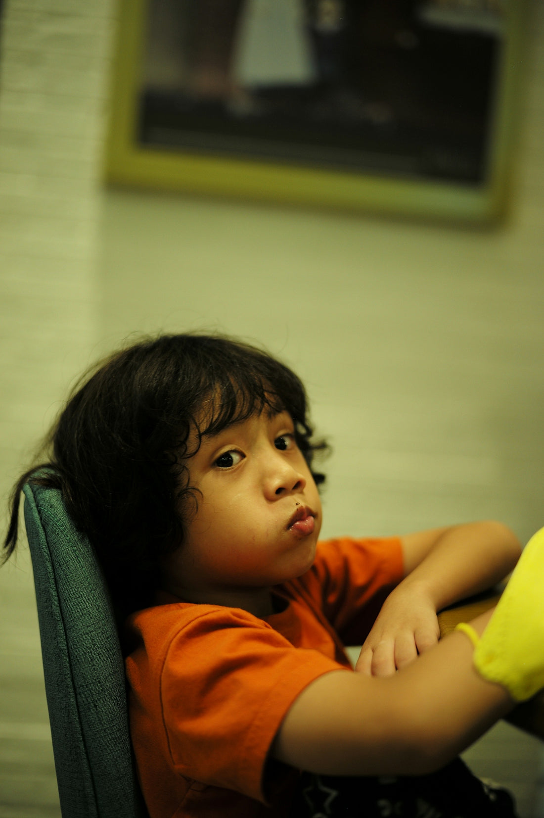 a boy sitting in a chair