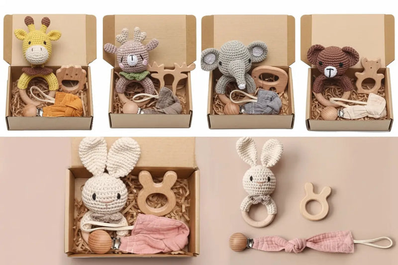 Set of baby toys in cardboard boxes on a pink background