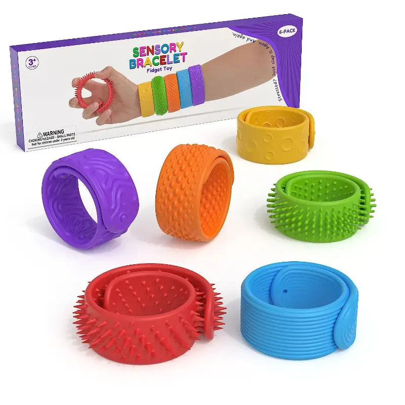 Set of colorful sensory bracelets with packaging on a white background